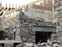 matching the new to the old - local stone facing to new cottage - March 2001 in Grasmere - Click to link to the Works page