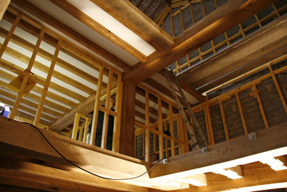 Barn conversion near Hawkshead interior oak beams and softwood studding by Joiner