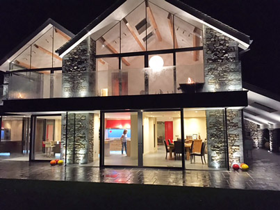 House above Grasmere remodelled for views - night time view